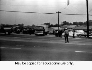 Police and protesters during the Atlanta sanitation workers strike, April 13, 1970. Here they are seen outside the Potter & Rayfield, Inc. facility, 1570 Northside Drive, Atlanta, Georgia.