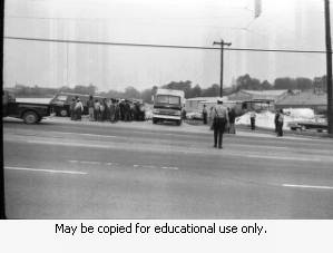 Police and protesters during the Atlanta sanitation workers strike, April 13, 1970. Here they are seen outside the Potter & Rayfield, Inc. facility, 1570 Northside Drive, Atlanta, Georgia.