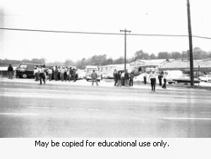Police and protesters during the Atlanta sanitation workers strike, April 13, 1970. Here they are seen outside the Potter & Rayfield, Inc. facility, 1570 Northside Drive, Atlanta, Georgia.