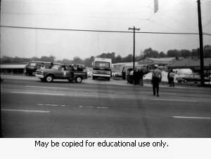 Police and protesters during the Atlanta sanitation workers strike, April 13, 1970. Here they are seen outside the Potter & Rayfield, Inc. facility, 1570 Northside Drive, Atlanta, Georgia.