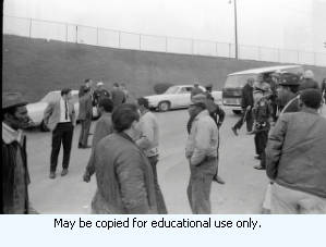 AFSCME Local 1644-led sanitation strike, Atlanta, Georgia, March 1970. These photographs are taken outside the City of Atlanta Construction Department office and warehouse (110-111 Hill Street). Protestors are apparently attempting to block strikebreakers from crossing the picket-line and entering the office area. The photograph series is labeled "Garbage Strike."