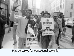Sanitation workers strike supporters marching in downtown Atlanta, Georgia, March 31, 1970. Photograph is part of a series labeled "Strike."