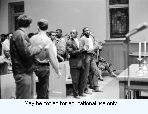 Jesse Epps, Assistant to the International President of the American Federation of State, County, and Municipal Employees (AFSCME), speaking to the Atlanta Local 1644, during the sanitation strike, in a church, Atlanta, Georgia, April 10, 1970.