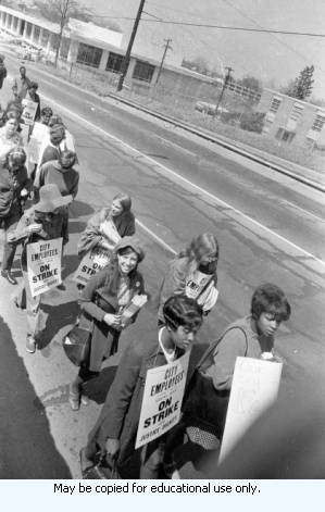 Sanitation workers strike supporters marching in downtown Atlanta, Georgia, March 23, 1970. Photograph is part of a series labeled "Garbage Strike."