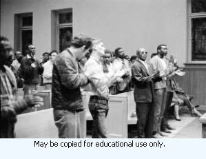 Jesse Epps, Assistant to the International President of the American Federation of State, County, and Municipal Employees (AFSCME), speaking to the Atlanta Local 1644, during the sanitation strike, in a church, Atlanta, Georgia, April 10, 1970.