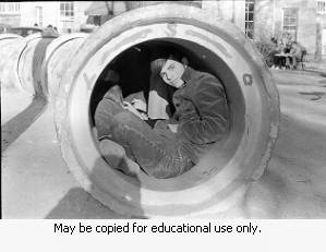 People inside a cement pipe, March 15, 1970.