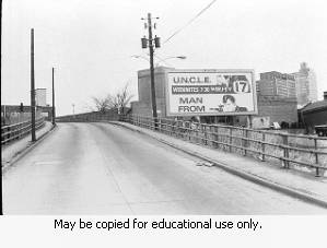 Channel 17 WJRJ-TV Billboard advertisement U.N.C.L.E> and Man From Week nites at 7:30, Billboard is located infront of W.B. George MFG CO. February 16,1970.
