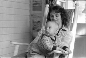 Family photos: Stephanie Coffin with her child on front porch, Atlanta, Georgia, June 2, 1974.