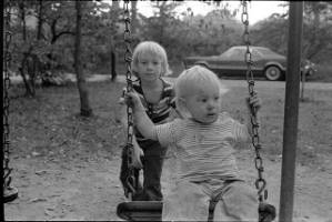 Family photos: Tom and Stephanie Coffin's children outdoors playing with a swing, Atlanta, Georgia, September 1, 1974.