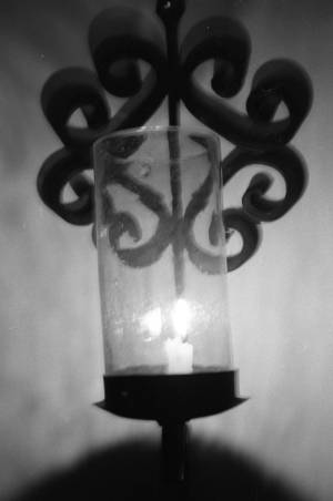 Lit candle wall sconce, 1969