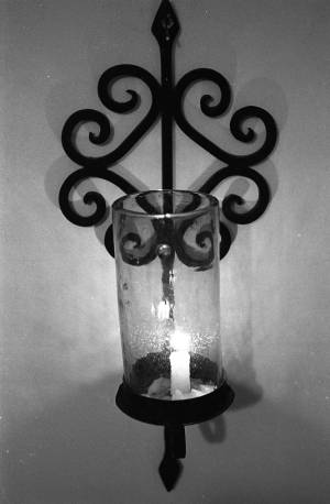 Lit candle wall sconce, 1969