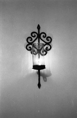 Lit candle wall sconce, 1969