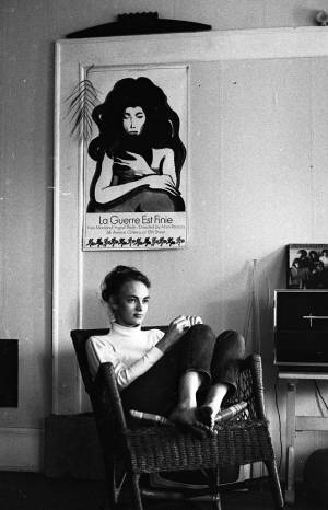 Stephanie Coffin louging in a rocking chair, 1969