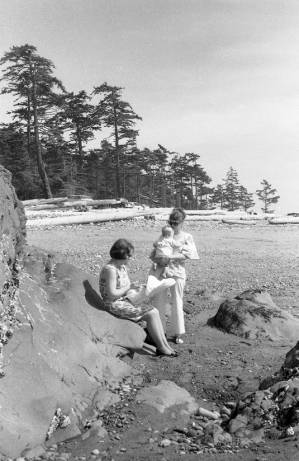 Stephanie Coffin and family walking on the beach, Whidbey Island, 1969