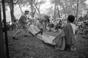 Actors performing Bertolt Brecht's play "The Exception and the Rule" in an outdoor venue, 1969