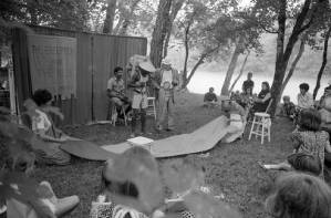 Actors performing Bertolt Brecht's play "The Exception and the Rule" in an outdoor venue, 1969