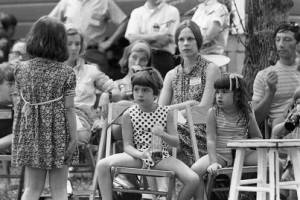 Audience at a performance of Bertolt Brecht's play "The Exception and the Rule" in an outdoor venue, 1969
