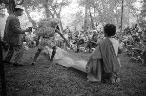 Actors performing Bertolt Brecht's play "The Exception and the Rule" in an outdoor venue, 1969