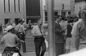 Pedestrians loitering downtown at five points, 1969