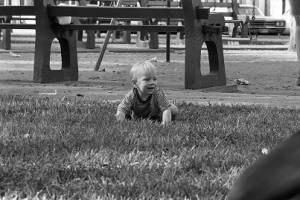 Zachary Coffin sitting on grass, 1969
