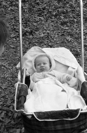 Zachary Coffin laying in a baby carriage, 1969