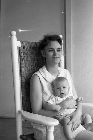 Stephanie and Zachary Coffin in a rocking chair, 1969