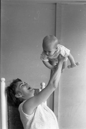Stephanie and Zachary Coffin in a rocking chair, 1969
