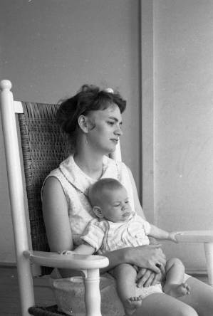 Stephanie and Zachary Coffin in a rocking chair, 1969