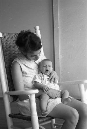 Stephanie and Zachary Coffin in a rocking chair, 1969
