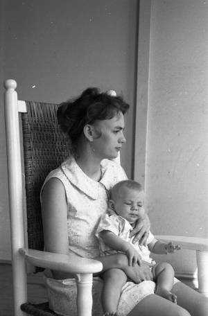 Stephanie and Zachary Coffin in a rocking chair, 1969