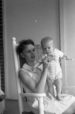 Stephanie and Zachary Coffin in a rocking chair, 1969
