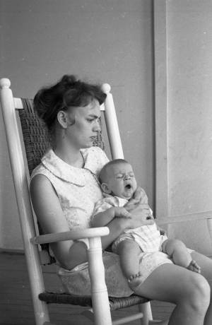 Stephanie and Zachary Coffin in a rocking chair, 1969
