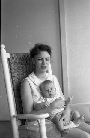 Stephanie and Zachary Coffin in a rocking chair, 1969