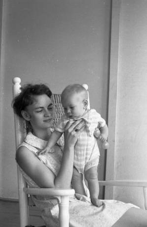 Stephanie and Zachary Coffin in a rocking chair, 1969