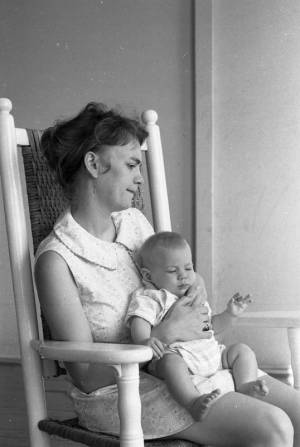 Stephanie and Zachary Coffin in a rocking chair, 1969