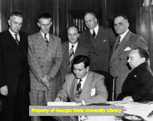 Gov. Herman Talmadge signing the Workmen's Bill