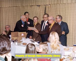 F. H. "Pug" King presenting a plaque