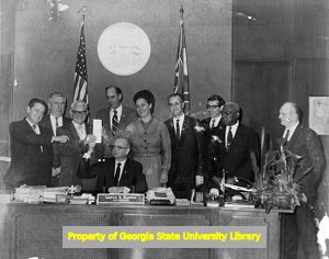 Governor Maddox signing the Minimum Wage Bill