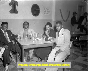 African-American Tobacco workers enjoying a Christmas party at the union hall, Charleston, S.C., circa 1950s.