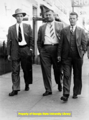 James B. Carey, Carey Haigler, and Eugene N. Wells on an unknown street