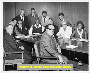 United Furniture Workers of America group sits around a table