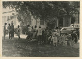 Youth baseball team with newspapers