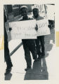 Children protesting with signs, "Do you want your freedom"