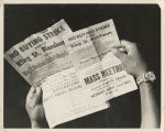 Person holding two flyers advertising boycott against King St. Merchants