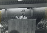 Man speaking at a podium