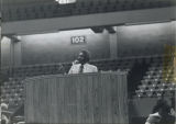 Man speaking at a podium