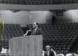 Man speaking at a podium