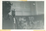 Odis Hyde speaks at microphone