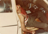 Santos Rodriguez dead from bullet wound in passenger seat of car