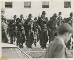Men in military uniform with rifles